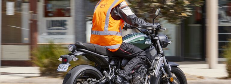 Rider in high visibility vest